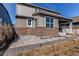 A beautiful patio and well-kept backyard on a sunny day with a covered porch at 17046 Desert Wine Trl, Parker, CO 80134