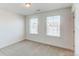 Bright bedroom with neutral walls, carpet flooring and natural light from large windows at 17046 Desert Wine Trl, Parker, CO 80134