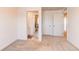 Bright bedroom with neutral colored walls, white trim, plush carpet, and entrances to the bathroom and hallways at 17046 Desert Wine Trl, Parker, CO 80134