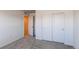 Neutral bedroom featuring closet with sliding doors and adjacent doorway at 17046 Desert Wine Trl, Parker, CO 80134