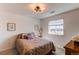 Inviting bedroom featuring neutral paint, stylish bed, and view from the window at 17046 Desert Wine Trl, Parker, CO 80134