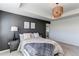 Stylish main bedroom with tray ceiling, accent wall, ambient lighting, and serene, inviting atmosphere at 17046 Desert Wine Trl, Parker, CO 80134