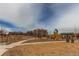 Community playground featuring a swing set and play structure with climbing and sliding features at 17046 Desert Wine Trl, Parker, CO 80134