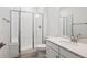 Bright bathroom featuring a glass-enclosed shower and a double sink vanity at 9197 Ironwood St, Highlands Ranch, CO 80129