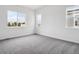 Bright bedroom with plush carpeting and large windows, offering ample natural light at 9197 Ironwood St, Highlands Ranch, CO 80129