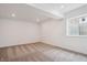 Bedroom with a window providing natural light and neutral carpeting at 9197 Ironwood St, Highlands Ranch, CO 80129