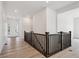 Bright hallway showcases wood floors and access to various living spaces at 9197 Ironwood St, Highlands Ranch, CO 80129