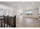 Open-concept living room features wood floors and great natural lighting at 9197 Ironwood St, Highlands Ranch, CO 80129
