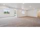 Spacious living room with bright natural light and neutral carpeting at 9197 Ironwood St, Highlands Ranch, CO 80129