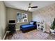 Well-lit bedroom with a ceiling fan and hardwood floors at 5660 S Algonquian Way # A, Aurora, CO 80016