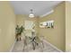 Bright dining area with neutral walls, light floors, with a pass-through to the kitchen at 5660 S Algonquian Way # A, Aurora, CO 80016
