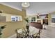 Open concept dining area featuring neutral walls and light-filled space at 5660 S Algonquian Way # A, Aurora, CO 80016