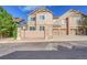 Street view of a townhome exterior with stone and siding, featuring a garage and manicured landscaping at 5660 S Algonquian Way # A, Aurora, CO 80016