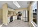 Functional kitchen with modern stainless steel appliances and bright lighting at 5660 S Algonquian Way # A, Aurora, CO 80016