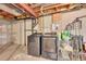 Laundry area in the basement featuring a washer, dryer and shelving at 5660 S Algonquian Way # A, Aurora, CO 80016
