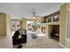 Bright living room with a cozy fireplace, neutral walls, and ample natural light at 5660 S Algonquian Way # A, Aurora, CO 80016