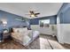 Bright and airy main bedroom featuring elegant decor and hardwood floors at 5660 S Algonquian Way # A, Aurora, CO 80016