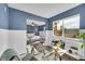 Bright home office featuring a desk and hardwood floors, open to the main bedroom at 5660 S Algonquian Way # A, Aurora, CO 80016