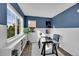 Bright home office with desk, shelves, and natural light at 5660 S Algonquian Way # A, Aurora, CO 80016