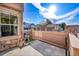 A patio features concrete, a wooden fence, and a view of garages at 5660 S Algonquian Way # A, Aurora, CO 80016