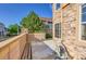 This patio features concrete, a wooden fence, and nearby houses at 5660 S Algonquian Way # A, Aurora, CO 80016