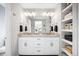 Double vanity bathroom with granite countertops and open shelving at 5245 W 97Th Ave, Broomfield, CO 80020