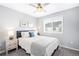 Bright bedroom with a queen bed, nightstand and window at 5245 W 97Th Ave, Broomfield, CO 80020