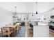 Modern kitchen with white cabinets, center island and breakfast nook at 5245 W 97Th Ave, Broomfield, CO 80020