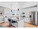 Modern kitchen with white cabinets, stainless steel appliances, and an island at 5245 W 97Th Ave, Broomfield, CO 80020