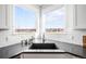 Kitchen corner sink with dark countertop and view of the park at 5245 W 97Th Ave, Broomfield, CO 80020