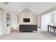 Cozy living room featuring vaulted ceilings and contemporary decor, creating a comfortable space at 6854 Carr St, Arvada, CO 80004