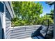 A cozy balcony provides serene views of lush, mature trees at 8500 E Jefferson Ave # 19B, Denver, CO 80237