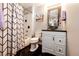 Bathroom featuring a vanity with a vessel sink and a bathtub with shower and decorative tile at 8500 E Jefferson Ave # 19B, Denver, CO 80237