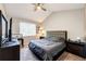 Bedroom featuring vaulted ceilings, neutral walls, carpet flooring and a contemporary furniture set at 8500 E Jefferson Ave # 19B, Denver, CO 80237