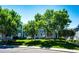 Townhouse complex with blue siding, green landscaping and mature trees at 8500 E Jefferson Ave # 19B, Denver, CO 80237