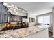 Modern kitchen featuring granite countertops, stainless steel appliances and dark cabinetry at 8500 E Jefferson Ave # 19B, Denver, CO 80237