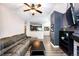 Living room featuring a comfortable sectional sofa, and an open view to the kitchen at 8500 E Jefferson Ave # 19B, Denver, CO 80237