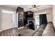A modern living room featuring a fireplace, comfortable sectional sofa, and a balcony at 8500 E Jefferson Ave # 19B, Denver, CO 80237