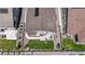 Aerial view showcasing a backyard with a patio, lush green lawn, and well-maintained landscaping at 8844 S Sicily Ct, Aurora, CO 80016