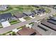 Aerial shot of a neighborhood featuring well-maintained lawns and modern homes with solar panels at 8844 S Sicily Ct, Aurora, CO 80016
