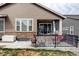 Outdoor living space featuring a patio with table and chairs with natural gas firepit and grill at 8844 S Sicily Ct, Aurora, CO 80016