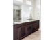 Bathroom featuring double sinks, granite countertops, and tile flooring at 8844 S Sicily Ct, Aurora, CO 80016
