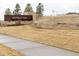 Elegant community entrance sign reading 'Inspiration' set against landscaped grounds and stone accents at 8844 S Sicily Ct, Aurora, CO 80016