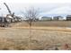 Scenic view of the community park, showcasing walking paths and homes in the distance at 8844 S Sicily Ct, Aurora, CO 80016