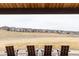 Scenic view from a covered patio with comfortable seating overlooking the community at 8844 S Sicily Ct, Aurora, CO 80016