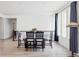 Bright dining room with a table set for a meal, featuring hardwood floors at 8844 S Sicily Ct, Aurora, CO 80016