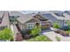 Beautiful home with a well-kept front lawn, stone accents, and a two-car garage at 8844 S Sicily Ct, Aurora, CO 80016