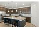 The modern kitchen boasts stainless steel appliances, granite counters, and plenty of cabinet space at 8844 S Sicily Ct, Aurora, CO 80016