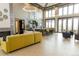Bright and stylish lounge area with modern furnishings, fireplace, and ample seating at 8844 S Sicily Ct, Aurora, CO 80016