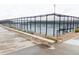 Outdoor tennis courts featuring a surrounding fence, benches, and manicured landscaping for an active lifestyle at 8844 S Sicily Ct, Aurora, CO 80016
